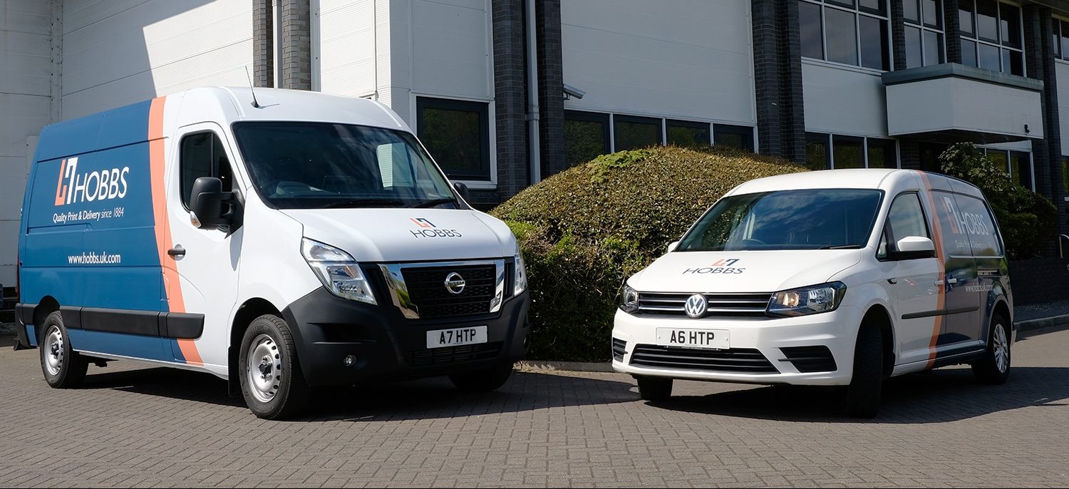 Two vans branded in the new Hobbs logo livery.